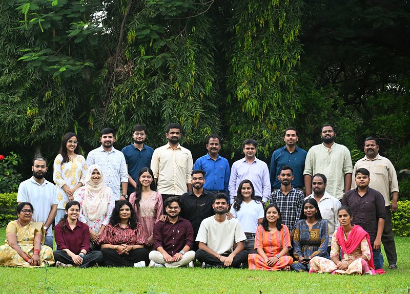 Full lab group photo on the lawn