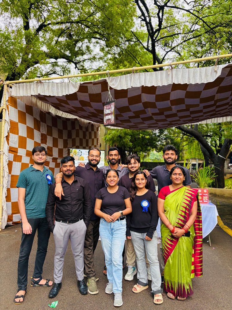 Team members in front of the outreach stall